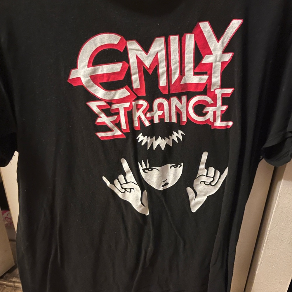 Emily the Strange shirt from Hot Topic. It’s red white and black, women’s size L